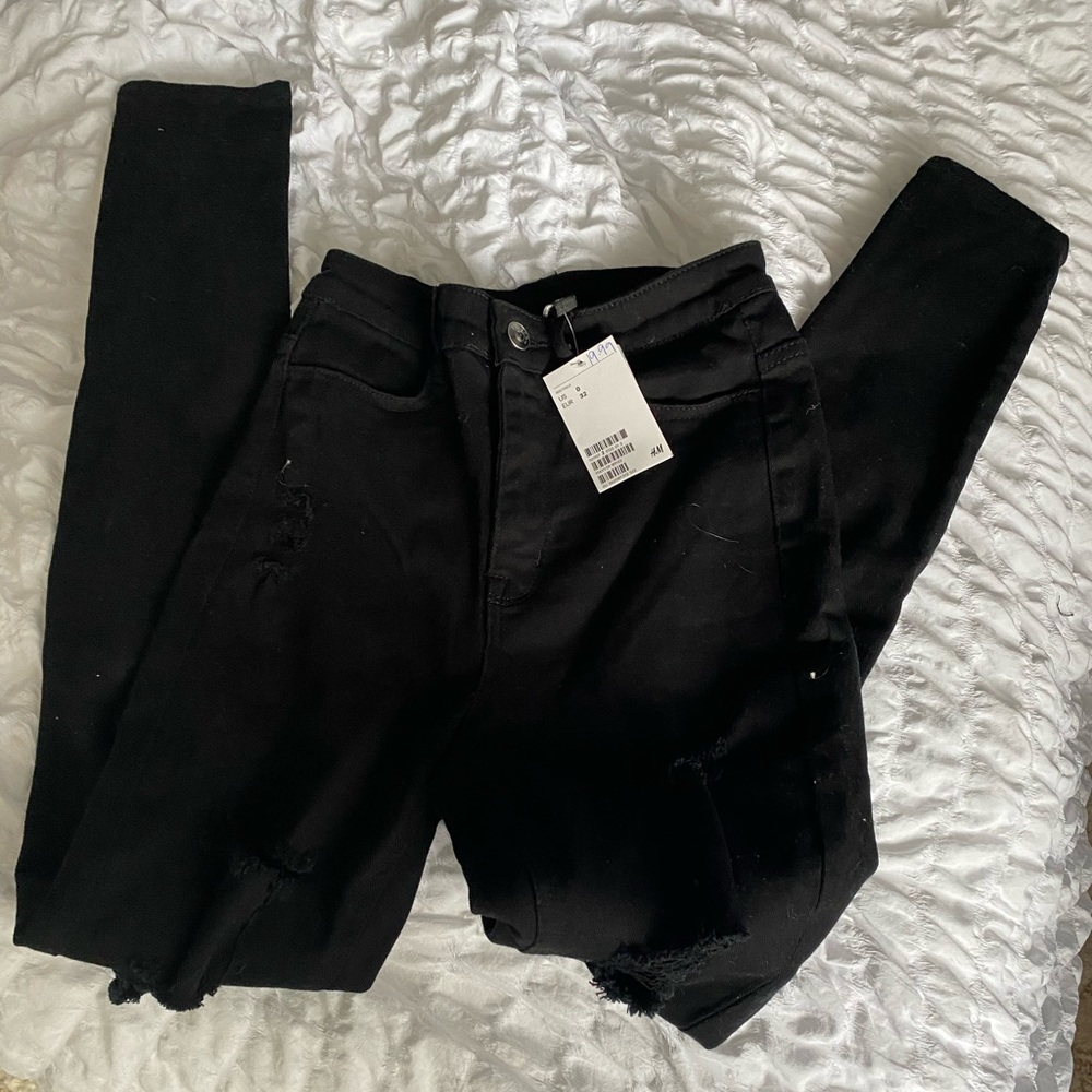 Black slightly ripped skinny jeans
